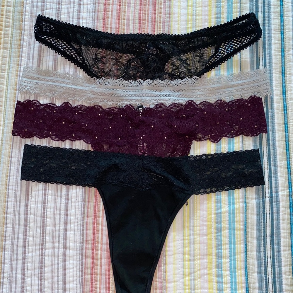 NWOT 4 thong panties from Victoria’s Secret. Sz large, 2 black, 1 plum, 1 beige